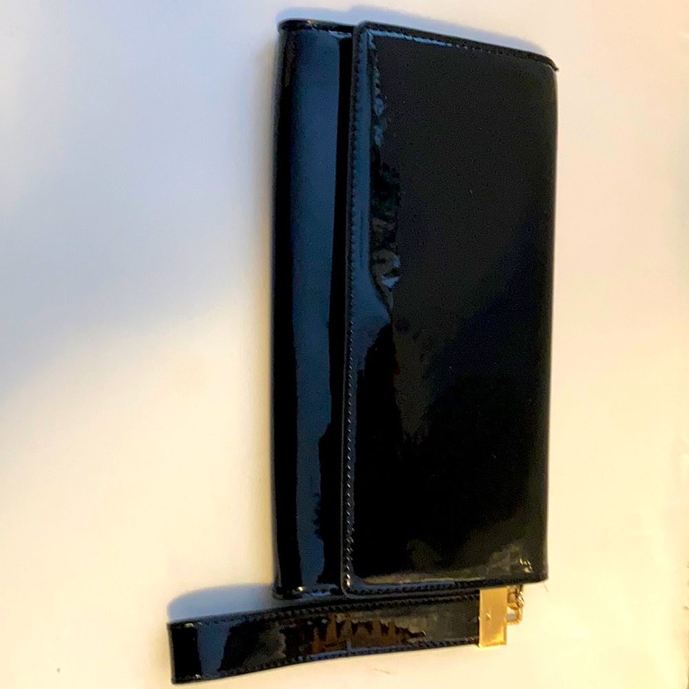 Aldo black clutch/wristlet. New, has not been used.